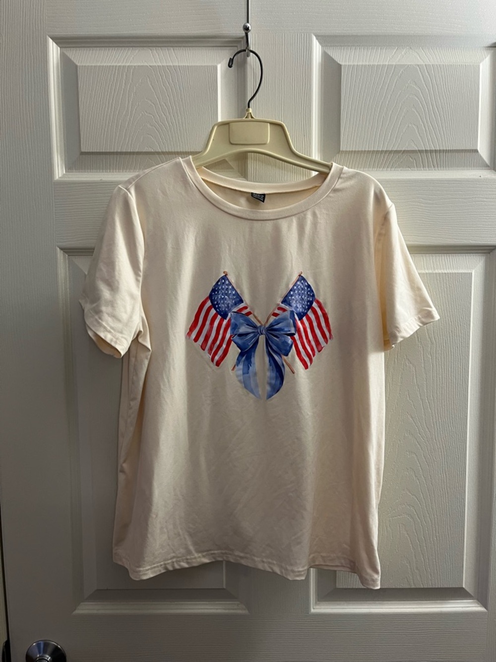 SHEIN Cream Tee with Blue Bow and American Flag Graphic
